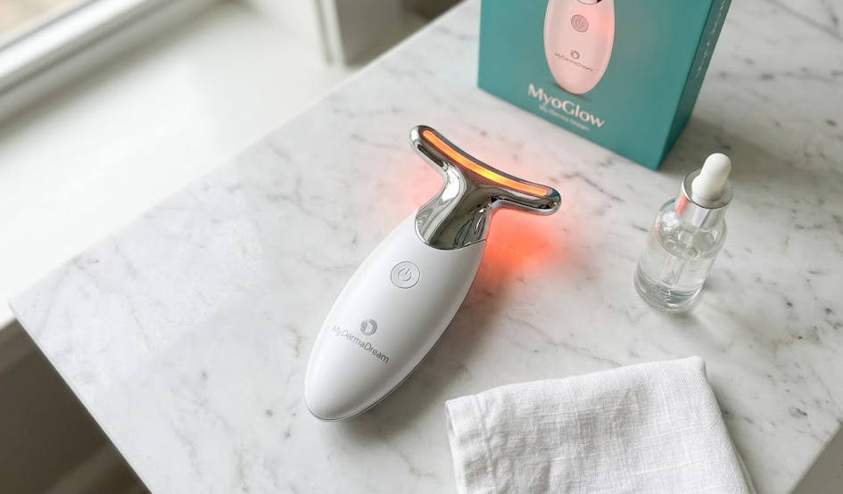 MyoGlow Sculpt and Firm device on marble surface with natural light