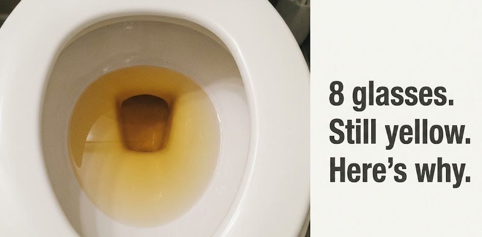 A glass of water with an Instant Hydration packet dissolving on a bathroom counter, warm morning light